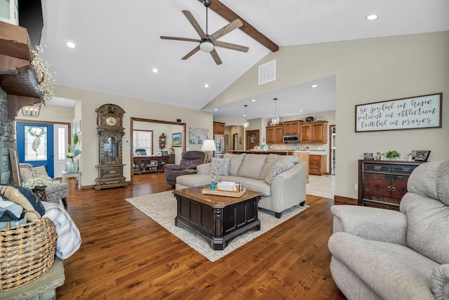 living room with high vaulted ceiling, visible vents, ceiling fan, beam ceiling, and hardwood / wood-style floors