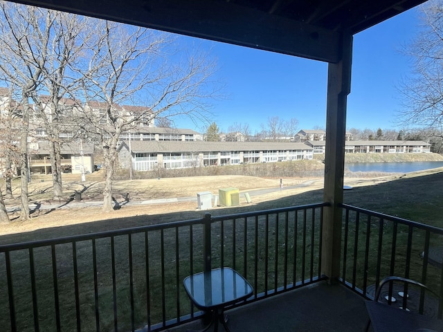 balcony featuring a water view