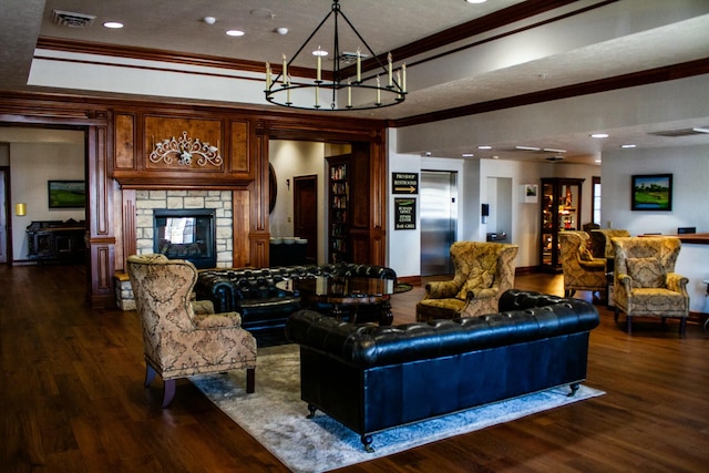 living room featuring dark wood-style flooring, elevator, ornamental molding, and visible vents