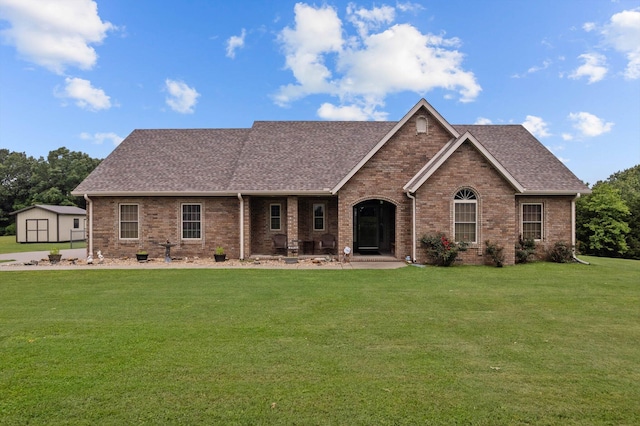 5651 State Highway 125 S, Sparta, MO 65753 - view of front of house with a shingled roof, brick siding, and a front yard