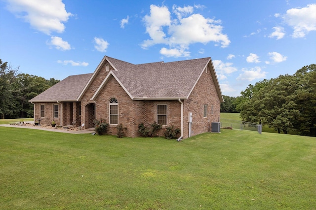 5651 State Highway 125 S, Sparta, MO 65753 - view of front of home with brick siding, a shingled roof, and central AC