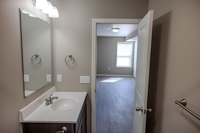 bathroom with baseboards and vanity