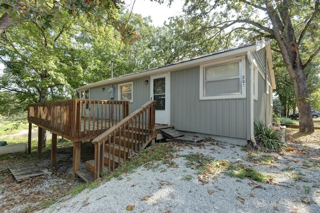 view of front of property featuring a wooden deck