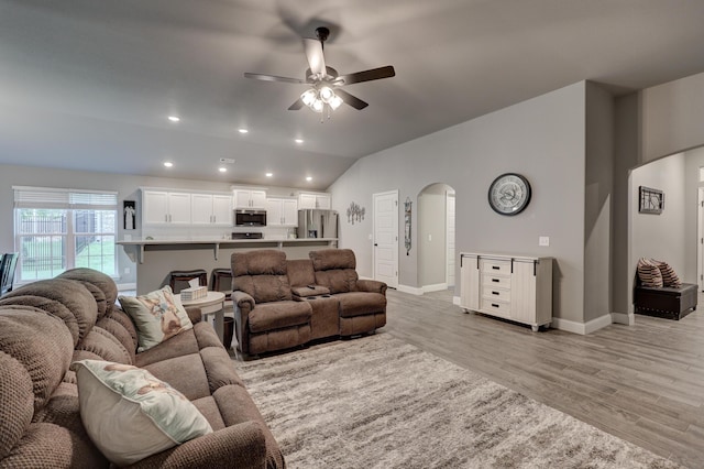 1859 Boyer Pl, Webb City, MO 64870 - living area with ceiling fan, recessed lighting, arched walkways, lofted ceiling, and light wood-style floors