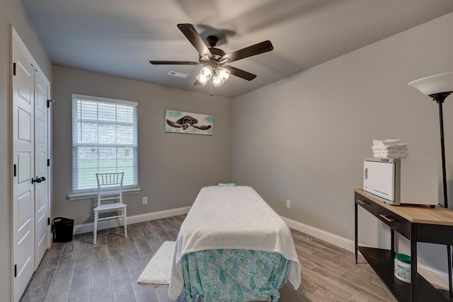 1859 Boyer Pl, Webb City, MO 64870 - bedroom featuring visible vents, baseboards, ceiling fan, and wood finished floors