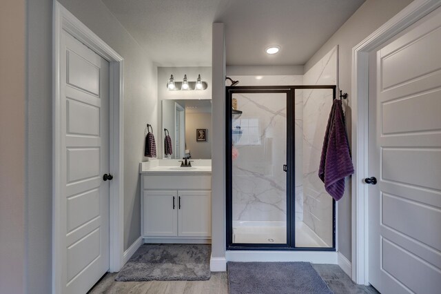1859 Boyer Pl, Webb City, MO 64870 - full bath featuring baseboards, a marble finish shower, vanity, and wood finished floors
