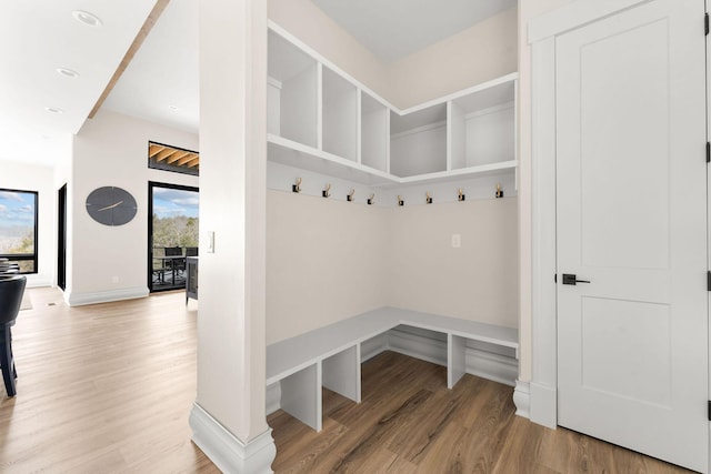 mudroom featuring baseboards, wood finished floors, and recessed lighting