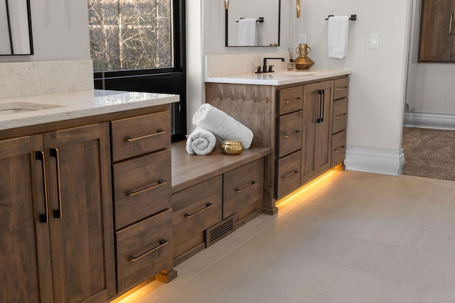 full bathroom featuring baseboards, vanity, and tile patterned floors