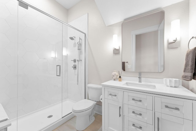 full bath with vanity, toilet, and a shower stall