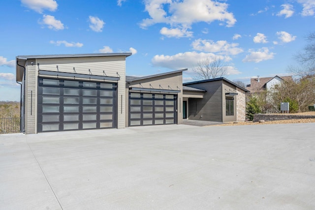 view of front of home with driveway and an attached garage