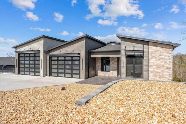 contemporary house featuring driveway and a garage
