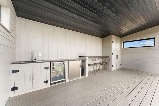 deck with beverage cooler and a sink