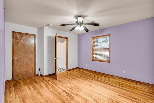 2505 Courtney Pl, West Plains, MO 65775 - unfurnished bedroom featuring light wood-style flooring, baseboards, and a ceiling fan