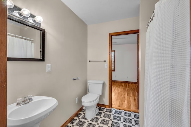 2505 Courtney Pl, West Plains, MO 65775 - full bath featuring a sink, toilet, and baseboards