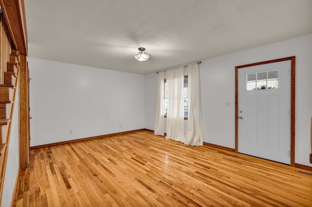 2505 Courtney Pl, West Plains, MO 65775 - entrance foyer with light wood-style flooring and baseboards