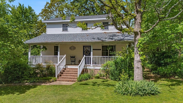 2505 Courtney Pl, West Plains, MO 65775 - farmhouse-style home featuring covered porch, a front yard, and roof with shingles
