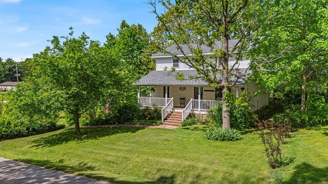 2505 Courtney Pl, West Plains, MO 65775 - view of front of property featuring a porch, a front lawn, and roof with shingles