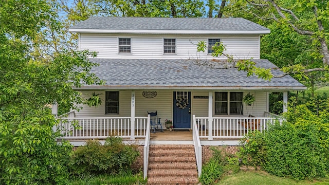 2505 Courtney Pl, West Plains, MO 65775 - farmhouse featuring a shingled roof and a porch
