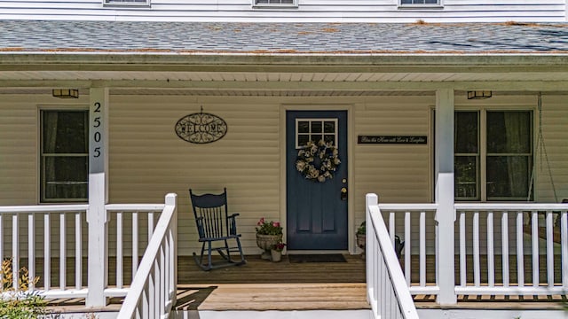 2505 Courtney Pl, West Plains, MO 65775 - doorway to property featuring a porch and a shingled roof
