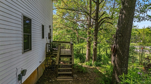 2505 Courtney Pl, West Plains, MO 65775 - view of property exterior featuring a wooden deck and stairway