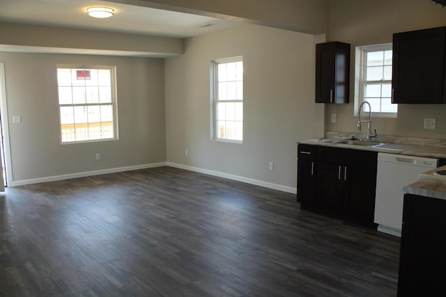 423 W Division St, Springfield, MO 65803 - kitchen with baseboards, dishwasher, a sink, light countertops, and dark wood finished floors