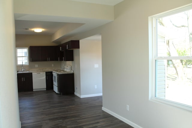 423 W Division St, Springfield, MO 65803 - kitchen with baseboards, a sink, dark wood-style flooring, light countertops, and white appliances