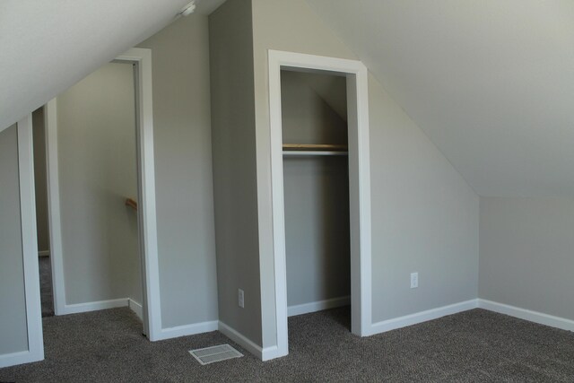 423 W Division St, Springfield, MO 65803 - interior space featuring visible vents, baseboards, carpet flooring, and vaulted ceiling