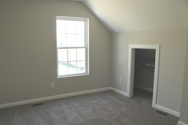 423 W Division St, Springfield, MO 65803 - additional living space with a healthy amount of sunlight, vaulted ceiling, and visible vents