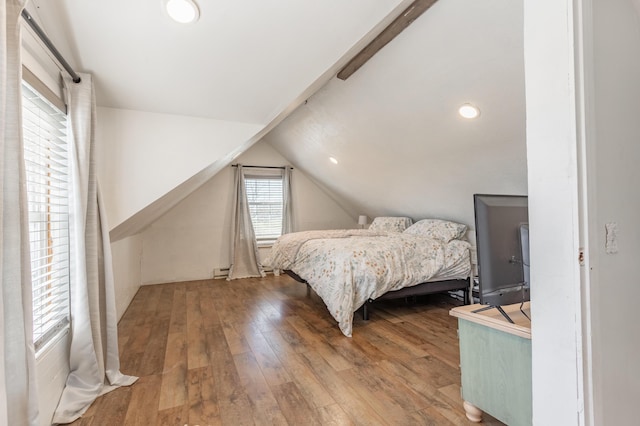bedroom featuring wood-type flooring, a baseboard heating unit, vaulted ceiling, and recessed lighting