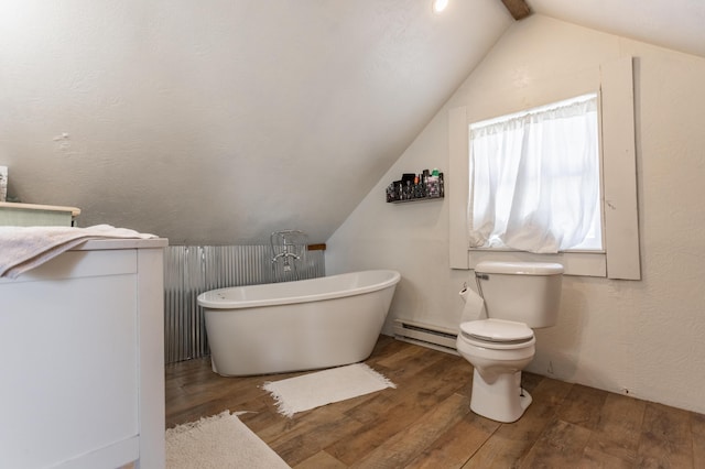 bathroom with hardwood / wood-style floors, vaulted ceiling, and baseboard heating