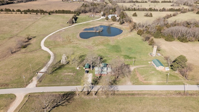 birds eye view of property with a water view and a rural view