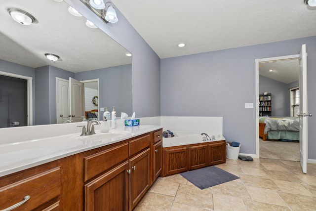 445 E Sequoia St, Republic, MO 65738 - bathroom with ensuite bath, vanity, a garden tub, and baseboards