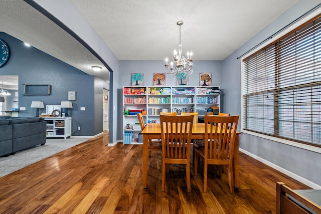 445 E Sequoia St, Republic, MO 65738 - dining space featuring baseboards, a chandelier, wood finished floors, and arched walkways
