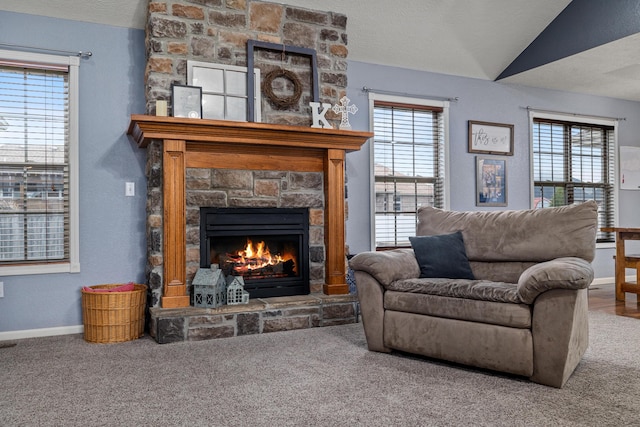 445 E Sequoia St, Republic, MO 65738 - living area with a stone fireplace, baseboards, healthy amount of natural light, carpet flooring, and vaulted ceiling