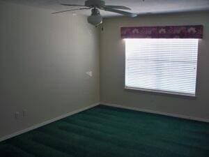 120 Spring Creek Ct Unit B1-U34, Branson, MO 65616 - spare room featuring baseboards, wood finished floors, and a ceiling fan