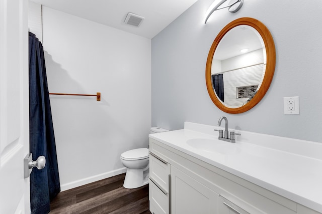 504 Brown St, Branson, MO 65616 - bathroom featuring toilet, wood finished floors, vanity, and baseboards