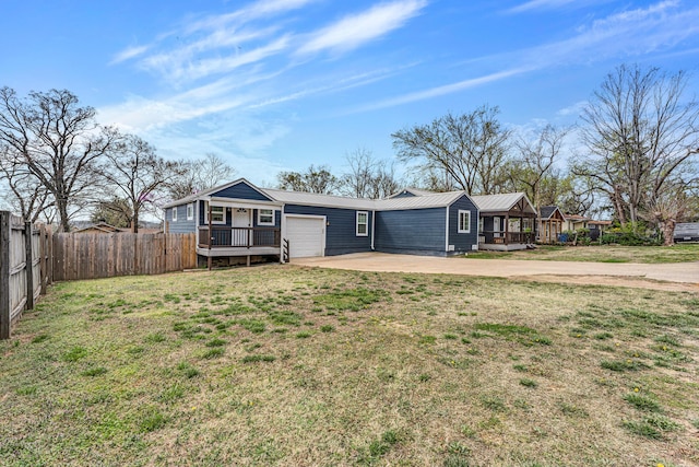 504 Brown St, Branson, MO 65616 - view of front of house featuring driveway, an attached garage, and metal roof