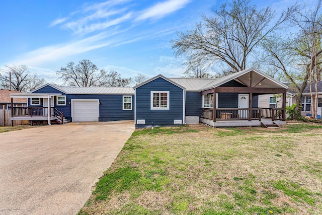 504 Brown St, Branson, MO 65616 - ranch-style house with concrete driveway, metal roof, a front lawn, a garage, and a deck