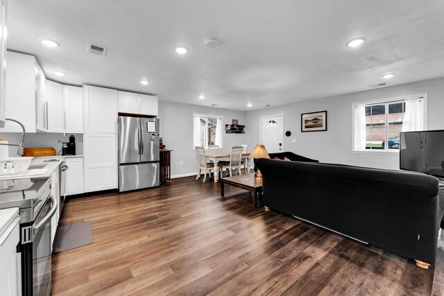 504 Brown St, Branson, MO 65616 - living room featuring wood finished floors, recessed lighting, and baseboards