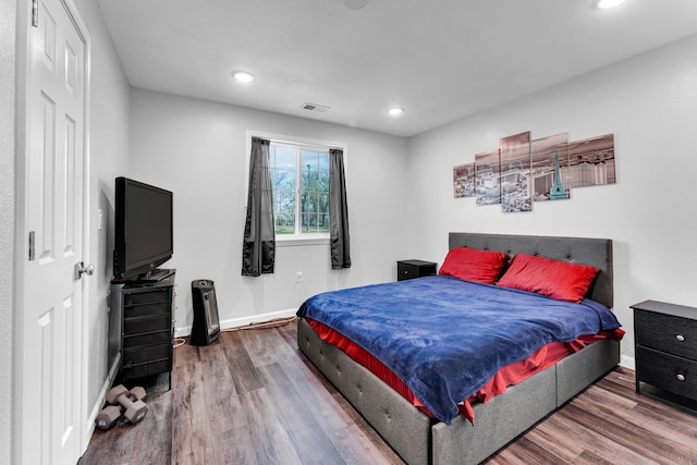 504 Brown St, Branson, MO 65616 - bedroom with wood finished floors, baseboards, and recessed lighting