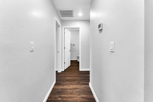 504 Brown St, Branson, MO 65616 - corridor featuring a textured wall, baseboards, and wood finished floors