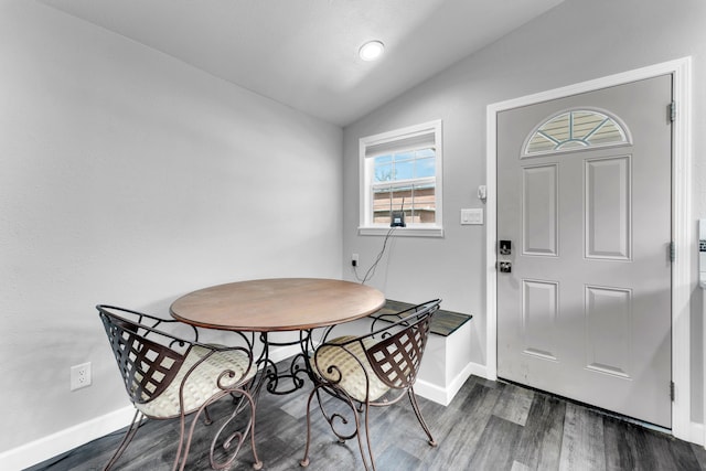 504 Brown St, Branson, MO 65616 - dining area with lofted ceiling, dark wood-style flooring, and baseboards