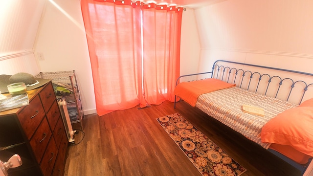 bedroom featuring wood finished floors