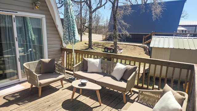 wooden terrace featuring outdoor lounge area