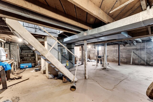 unfinished below grade area featuring stairs