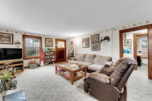 living room featuring light carpet