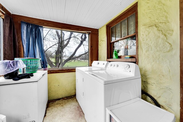 laundry area with independent washer and dryer, wooden ceiling, and laundry area