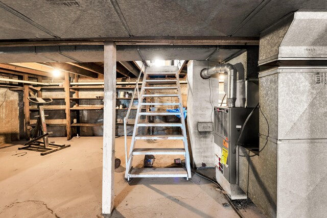 unfinished below grade area featuring stairs