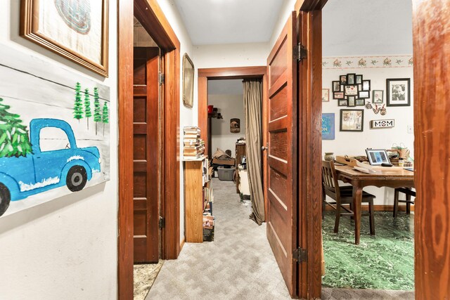 corridor with light colored carpet