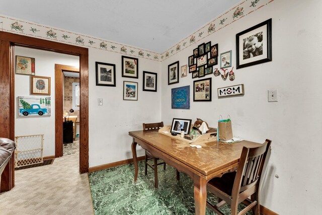 dining space with light carpet and baseboards